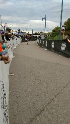 Leaving the transition area on his bicycle