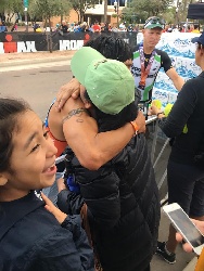 NHA receives a hug from mom after completing the race
